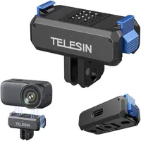Three angles of the TELESIN magnetic charging adapter base showing the folding 2-prong mount and blue quick-release buttons.