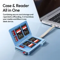 ULANZI DC01 open with memory cards stored inside, plugged into a laptop by its USB-C lanyard cabl