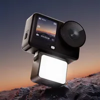 ULANZI LM24 attached beneath an action 6 camera with the panel lit, mounted without a housing.