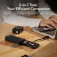 ULANZI CR2 card reader case open on a desk plugged in to a laptop, with memory cards in its slots.