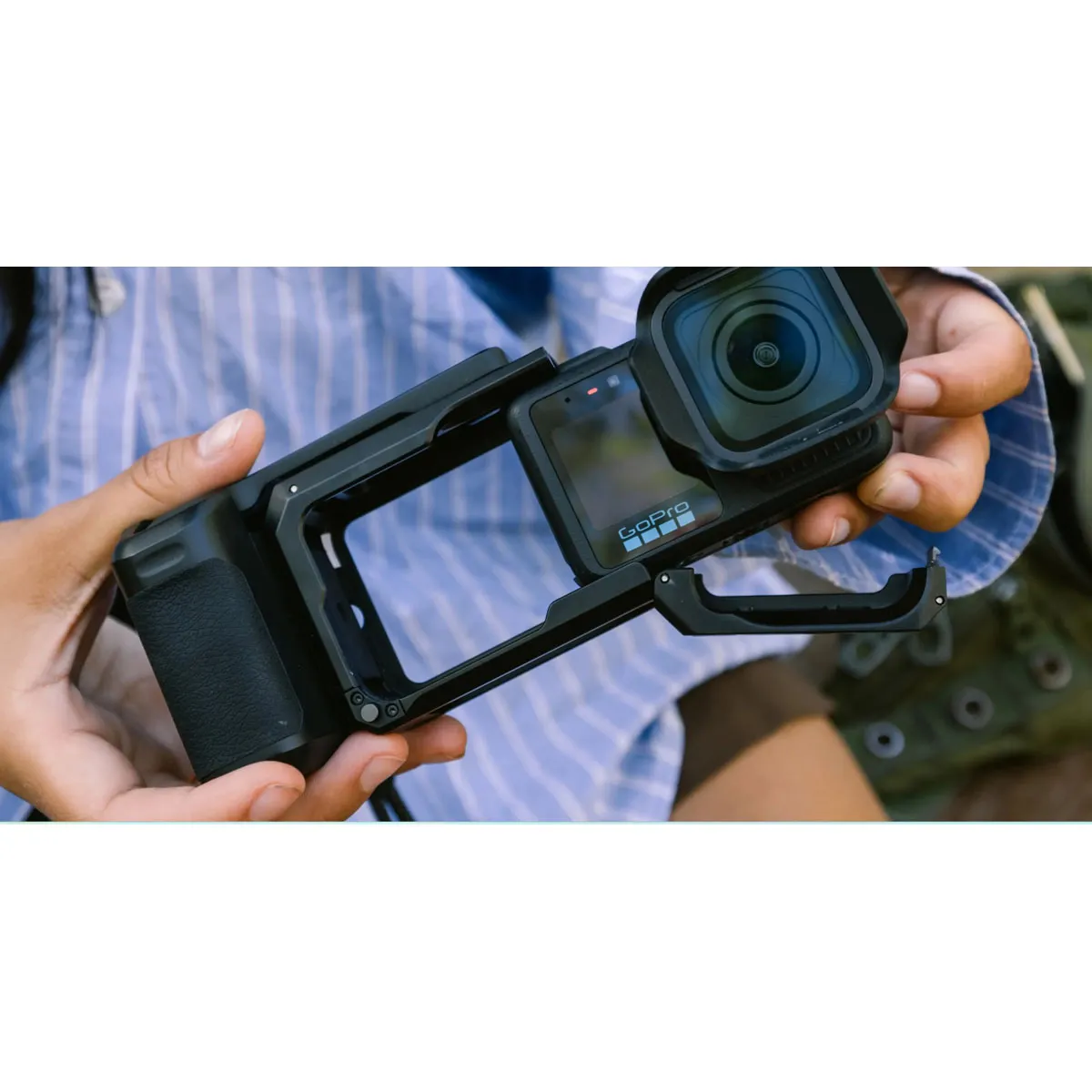 GoPro Point-and-Shoot Grip hinged frame door open, showing quick camera insertion.