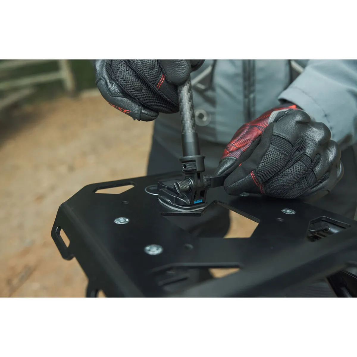 GoPro Locking 1/4-20 Mounting Buckle clipped into an adhesive mount, with Extension Pole.