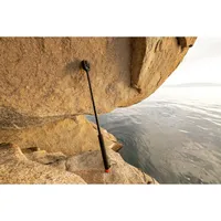 GoPro 80cm Floating Extension Pole extended with a 360 camera attached near the water.