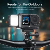 ULANZI LM24 fitted to an action camera on bike handlebars in the rain, rated IPX5 for splashes.