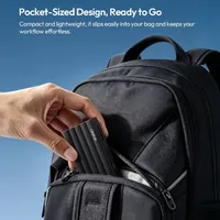 ULANZI DC04 memory card reader being slipped into a backpack pocket, showing its compact size.