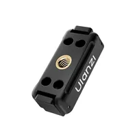 ULANZI OA26 adapter showing the 1/4 inch thread and the four tether holes on its underside.